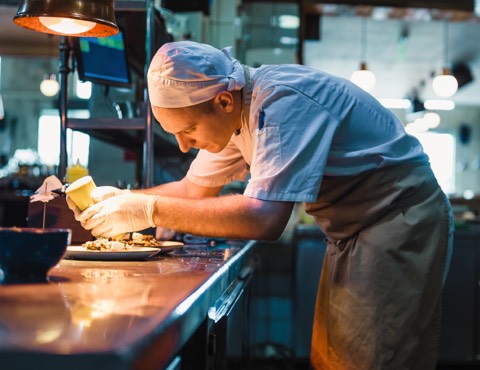 A chef working in a commercial kitchen