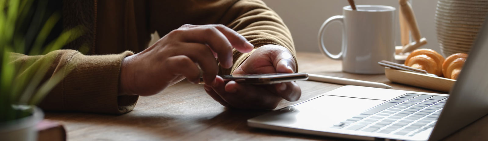 A close up of a person's hands holding a smartphone