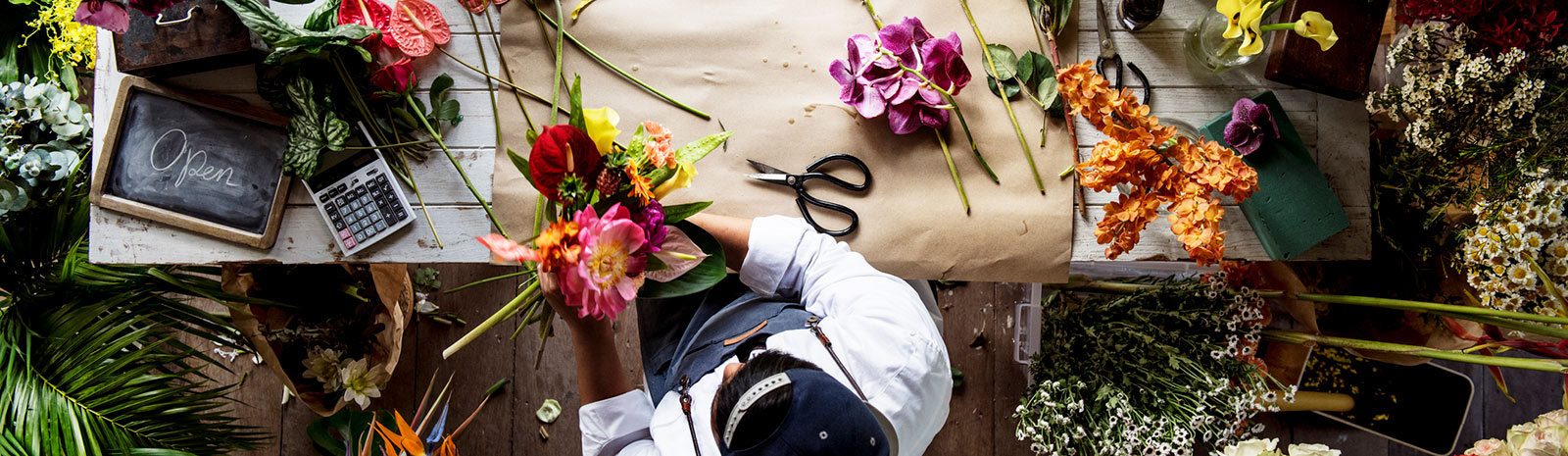 Top-down view of a person working with flowers